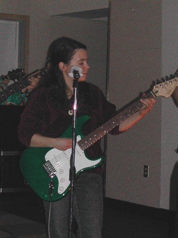 Sarah plays guitar